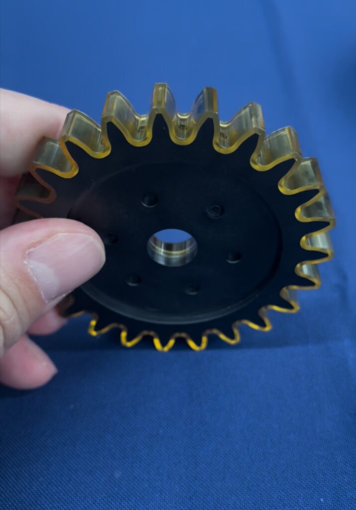 PEEK coated metal gear for low friction and reduced noise